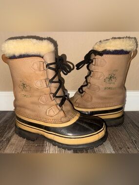 Size 7 men’s 8.5 women Sorel Women's Tan and Black Waterproof Winter Lace Boots